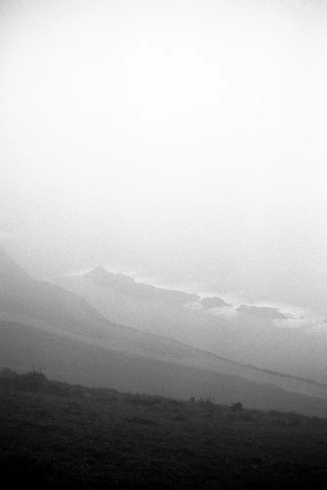 Black and white image of a foggy coastline