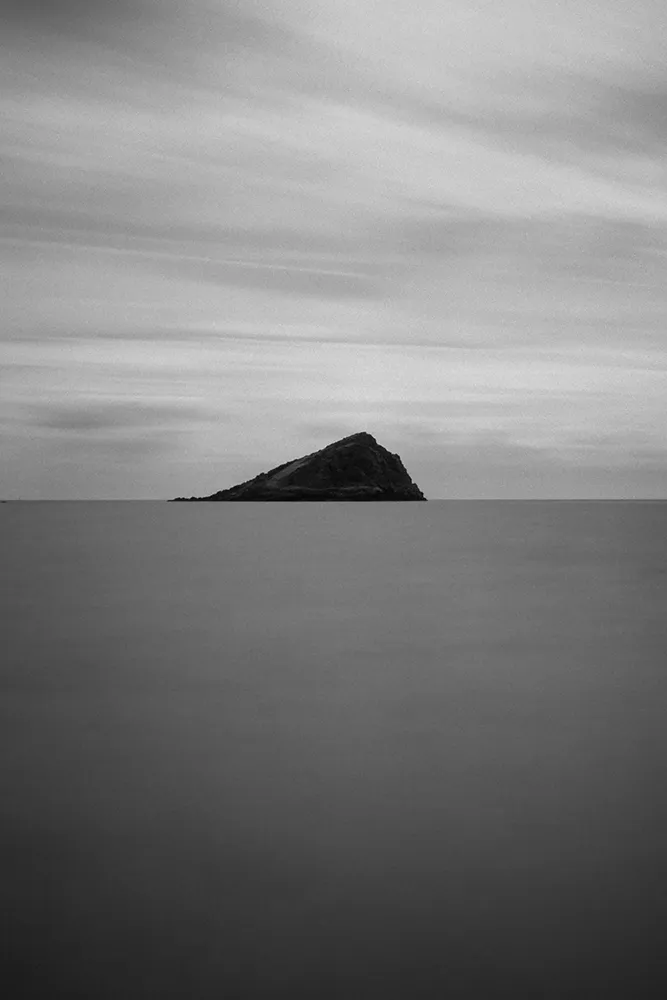 Black and white minimal image of Mewstone island